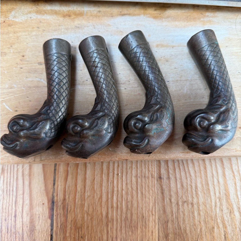 Set of Four Antique cast iron dolphin or  Dragon Head Table Legs